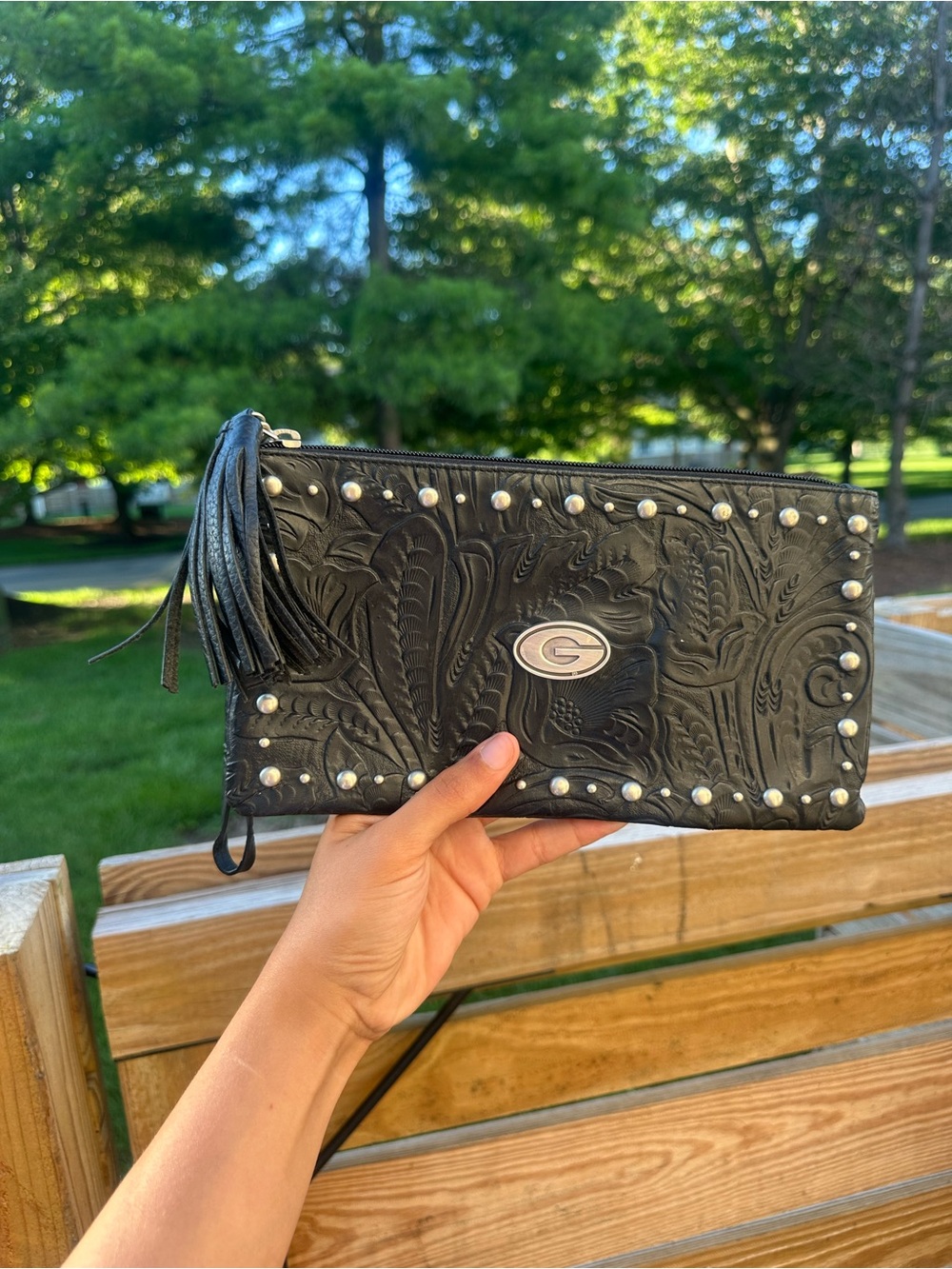 Embossed Black Leather Wristlet Clutch with Tassel and Stud Detail
